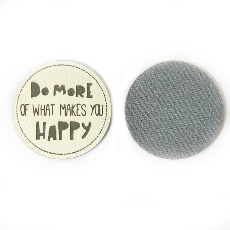 Leather labels, with the inscription "DO MORE OF WHAT MAKES YOU HAPPY"