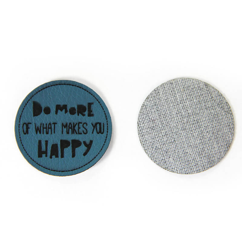 Leather labels, with the inscription "DO MORE OF WHAT MAKES YOU HAPPY"