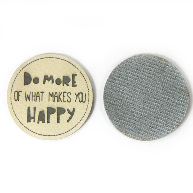Leather labels, with the inscription "DO MORE OF WHAT MAKES YOU HAPPY"