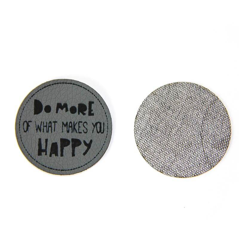 Leather labels, with the inscription "DO MORE OF WHAT MAKES YOU HAPPY"