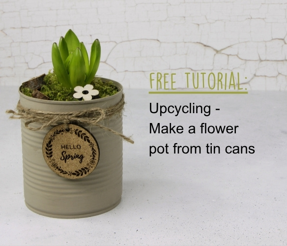 Flower pot made from recycled tin cans with painted decorative finish