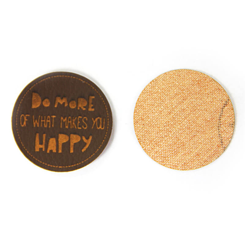 Leather labels, with the inscription "DO MORE OF WHAT MAKES YOU HAPPY"