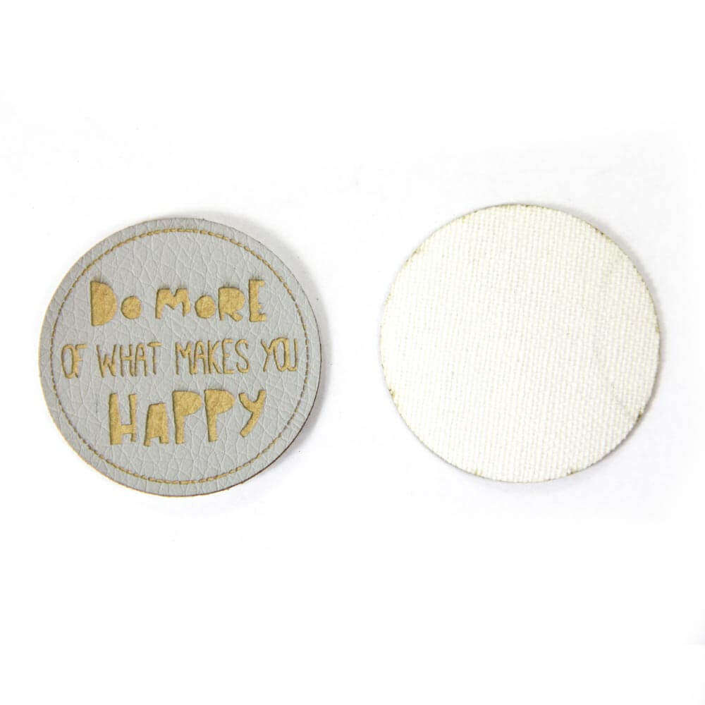 Leather labels, with the inscription "DO MORE OF WHAT MAKES YOU HAPPY"