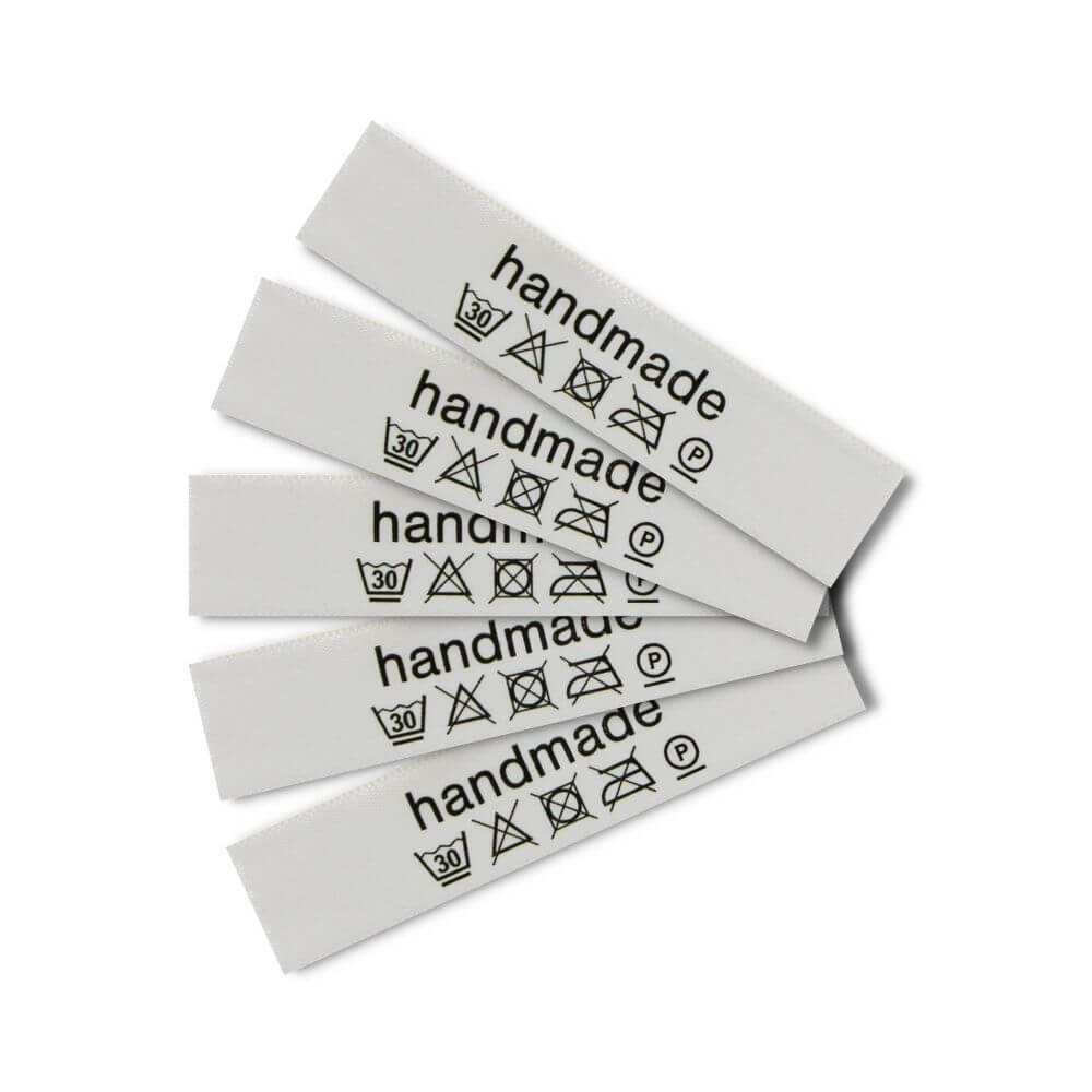 Care labels with washing and care symbols - Französisch