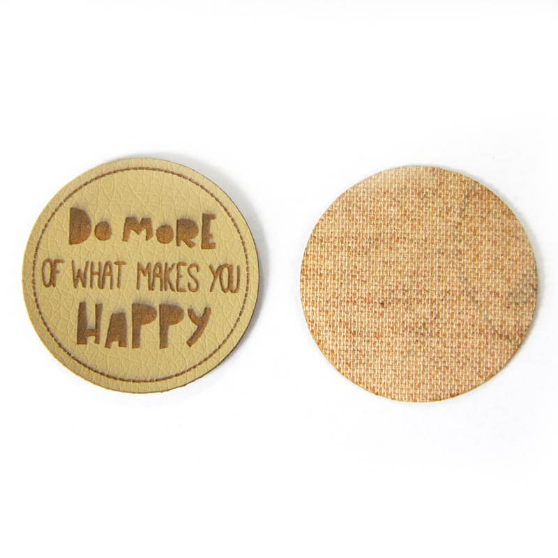 Leather labels, with the inscription "DO MORE OF WHAT MAKES YOU HAPPY"